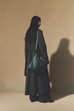 Camille, green coat