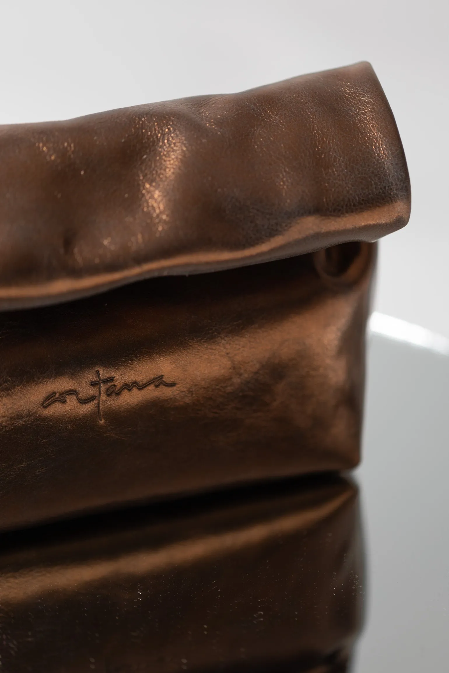 Delhi S, dark bronze leather clutch