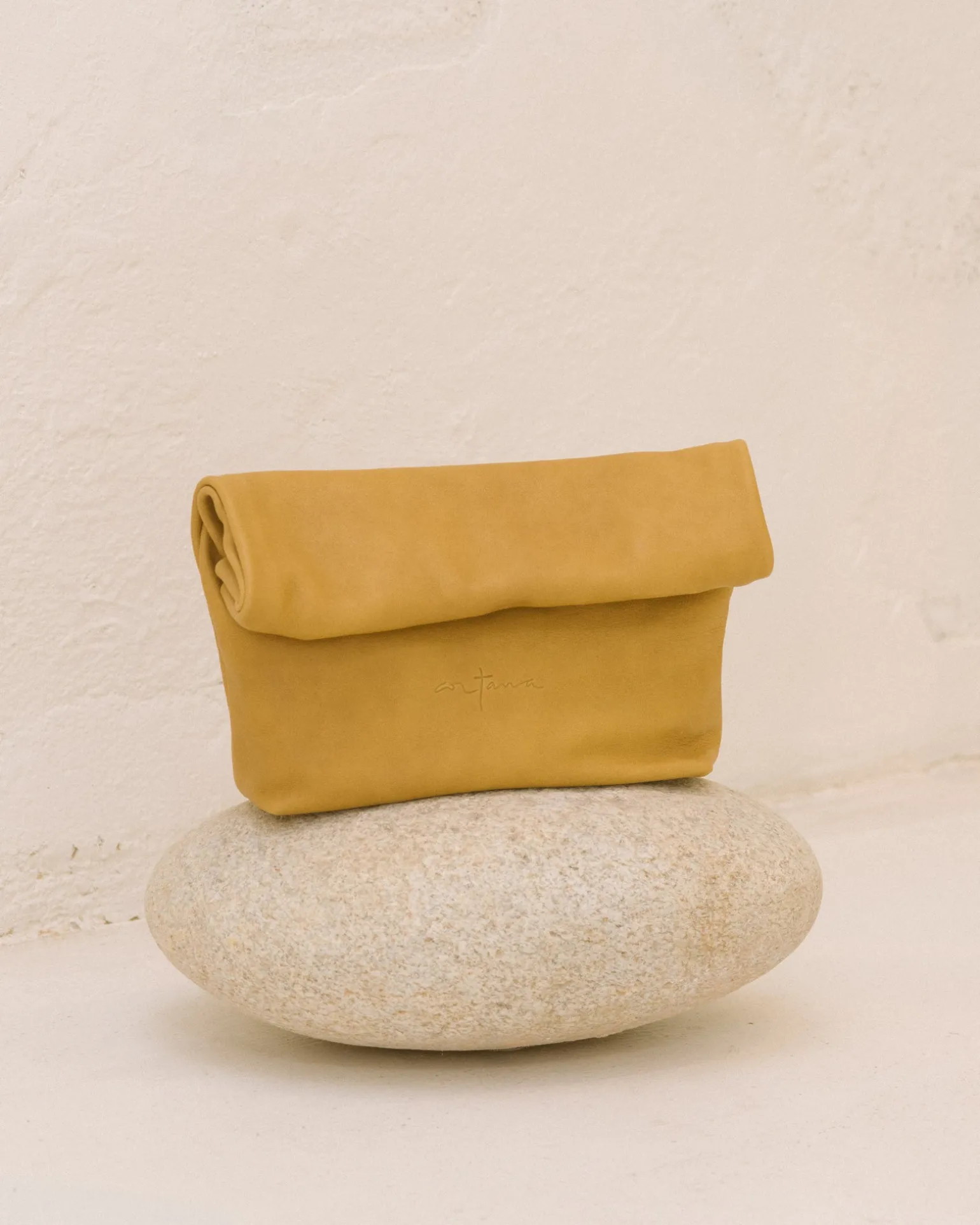 Delhi S, mustard leather clutch