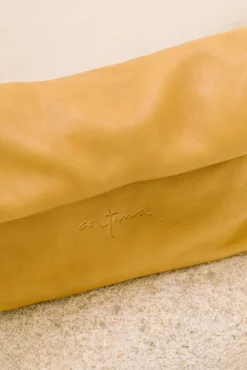 Delhi S, mustard leather clutch